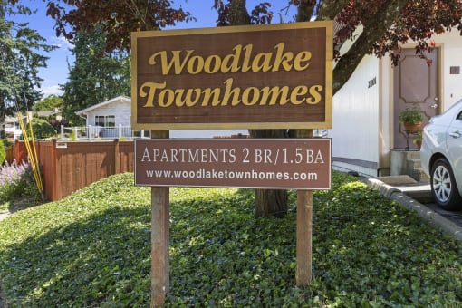 Property Signage with Grass Area underneath at Woodlake Townhomes, Edmonds, 98026