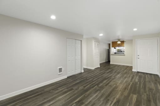 Open Space Living Room with Plank Flooring and Recessed Lighting at Park 210 Apartment Homes, Edmonds, 98026