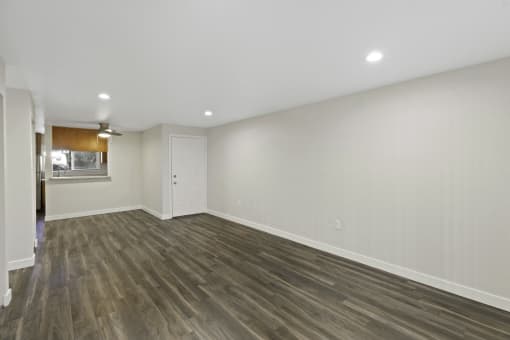 Oversized Living Room with Hardwood Floors and White Walls at Park 210 Apartment Homes, Edmonds, 98026