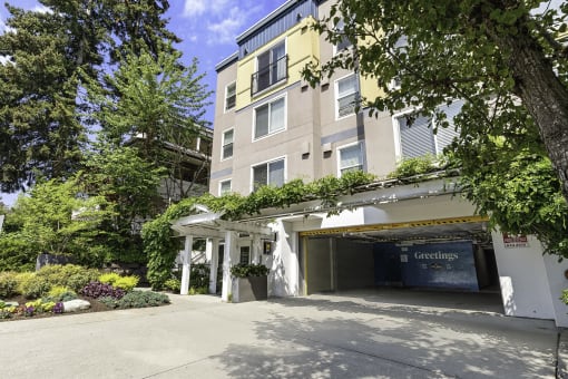 a large apartment building with a parking lot in front of it at Sir Gallahad Apartment Homes,  Bellevue, 98004