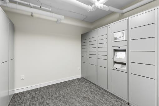 Resident Parcel Receiving Room with Package Lockers and Carpeted Floor at Sir Gallahad Apartment Homes, Washington