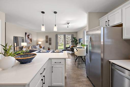 A modern kitchen with a large island and stainless steel appliances at Briarcliff Village, Michigan, 48390