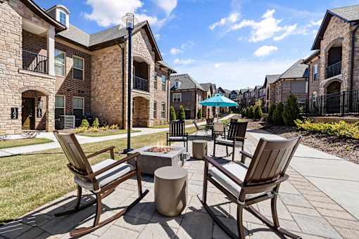 Patio with seating and fire pit at Griffin Weston apartments in Wake County, NC.