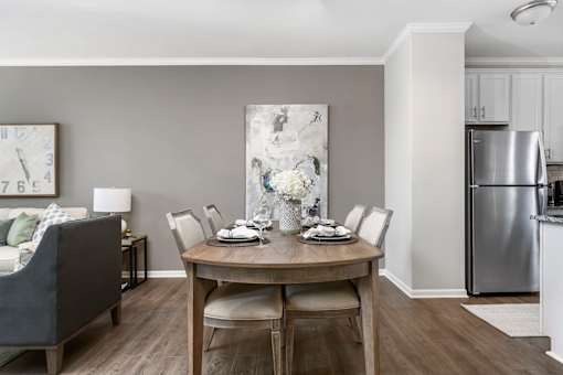 A modern dining room with a table set for four at Park West, Canton, 48187