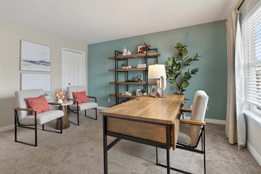 A room with a table and chairs in it.