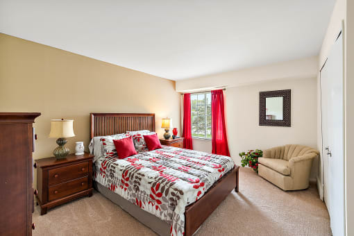 a bedroom with a bed and a chair  at Northridge, Michigan