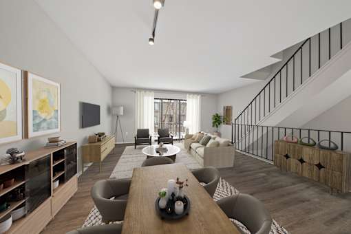 A modern living room with a staircase on the right side.