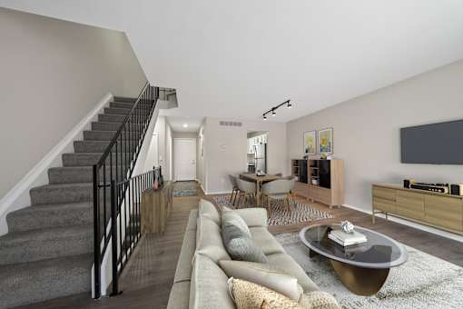 A living room with a grey couch and a coffee table.