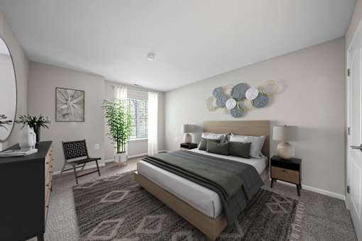 A bedroom with a large bed and a chair.