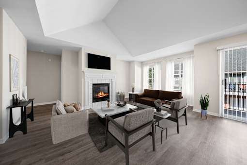 A modern living room with a fireplace and a brown couch.