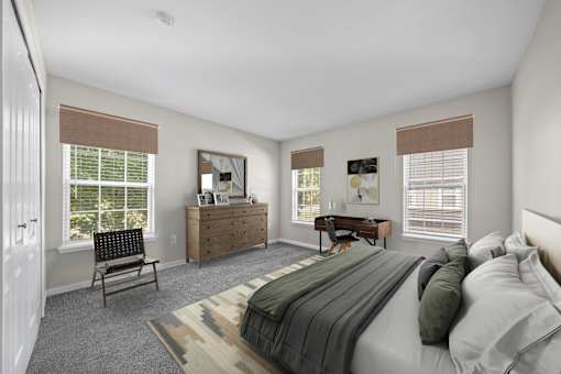 A bedroom with a bed, dresser, chair, and window.