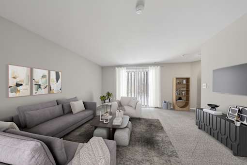 A living room with grey couches and a coffee table.