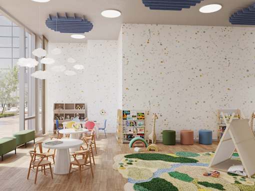A room with a white table surrounded by chairs and a wall with a pattern of small objects.