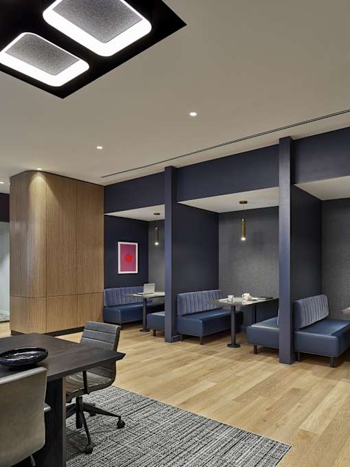 A conference room with a long table and chairs.