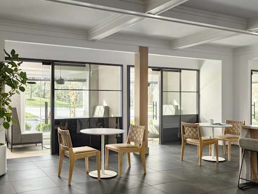 A room with a table and chairs in it.