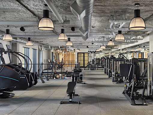 A gym with a variety of exercise equipment.