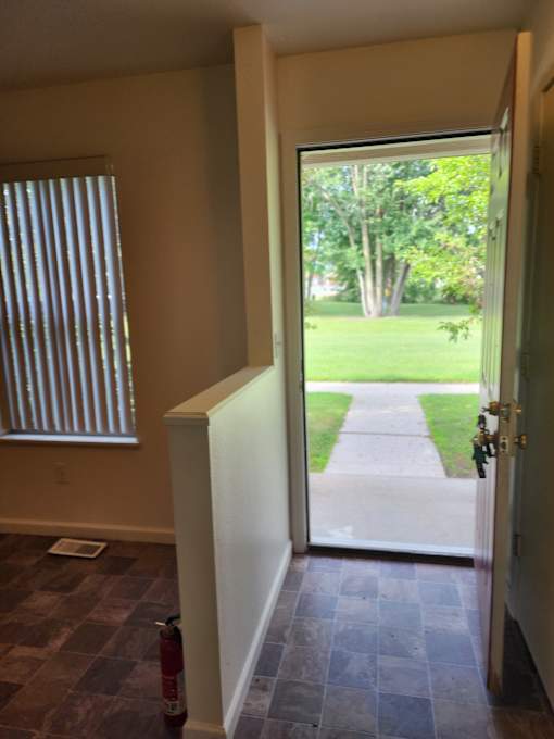 A window with blinds and a window sill.
