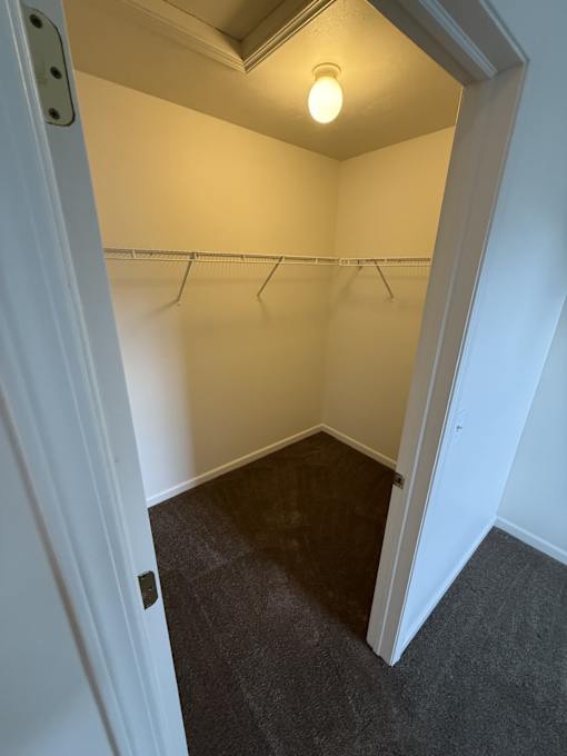 A small, empty room with a light on.