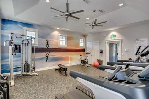 Fitness center with weights and treadmill at McHenry Square Apartments, Georgia, 30909