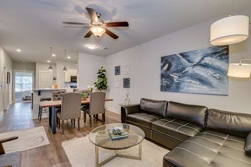 Open living room space with dining area at McHenry Square Apartments, Augusta