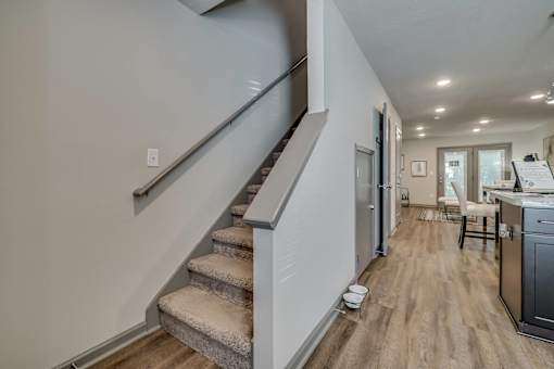 an open living room with stairs at Forest Hills Racquet Club, Georgia, 30909