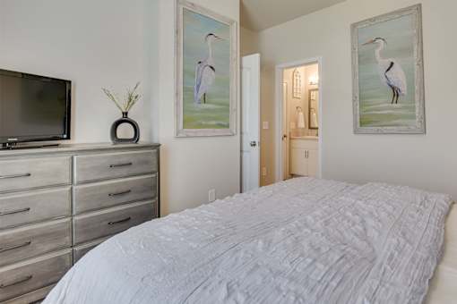 a bedroom with a bed and dresser at The Vista Apartments & Townhomes, South Carolina, 29851