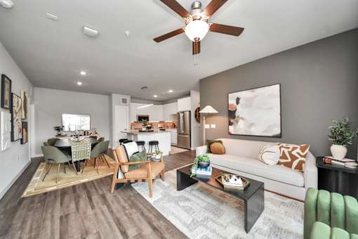 A living room with a dining table and chairs.