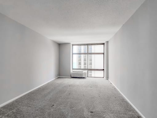an empty room with a large window