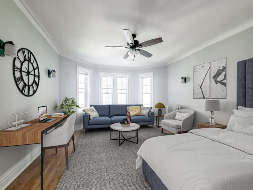 a bedroom with a bed and a ceiling fan