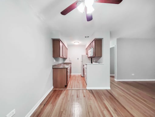 a kitchen and dining area in a 555 waverly unit