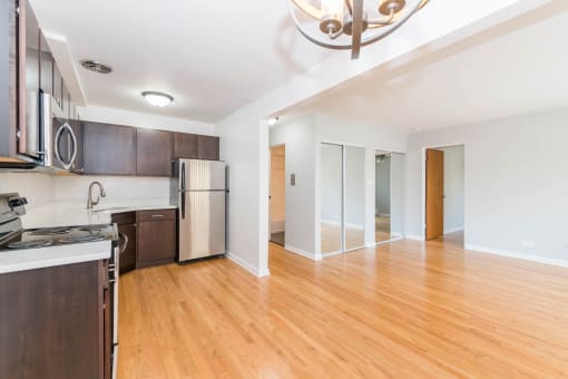 a kitchen and living room in a 555 waverly unit
