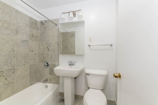 a bathroom with a sink toilet and bathtub