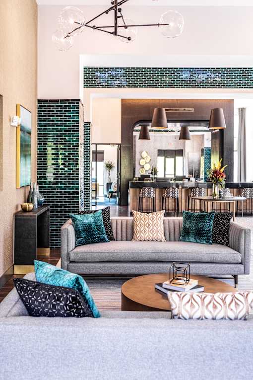 A living room with a grey couch and a coffee table.