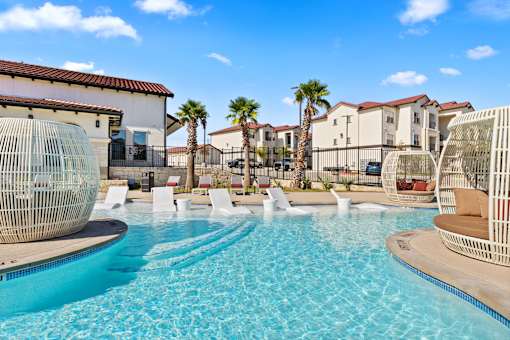 the swimming pool at the preserve at polo towers apartments