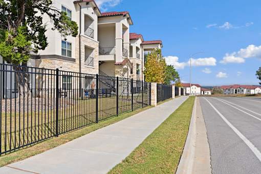 a row of houses on the side of a street