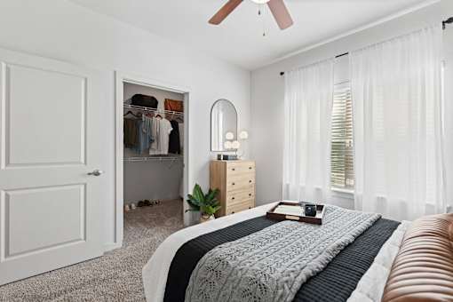 a bedroom with a bed and a closet