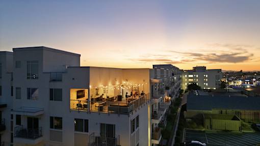 the view from the roof of a building at sunset