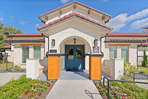 the front of a building with a blue door