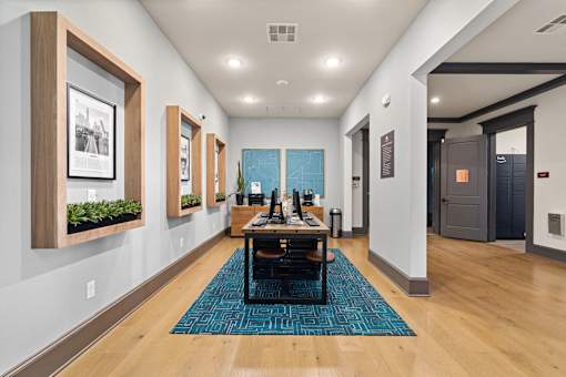 a conference room with a table and chairs and a blue rug