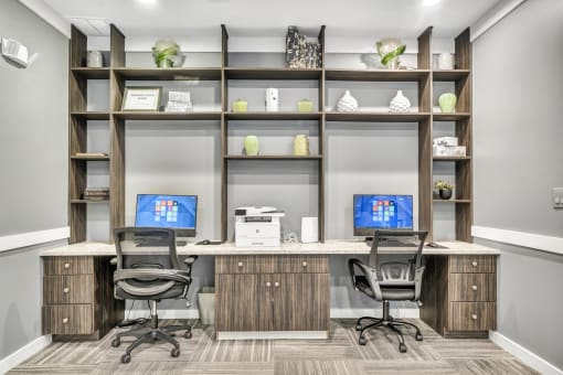 an office with two desks and two chairs