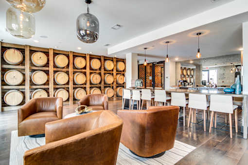 A room with a wine rack and a bar area.