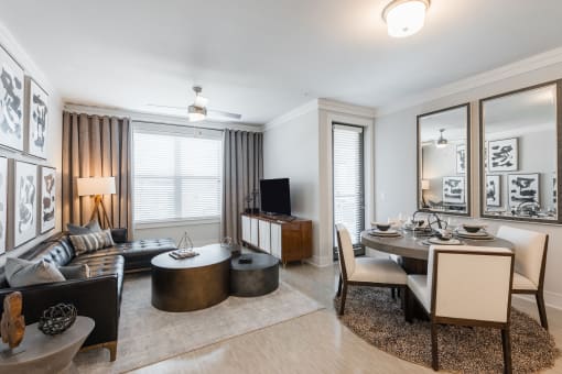 a living room and dining room in a two bedroom apartment