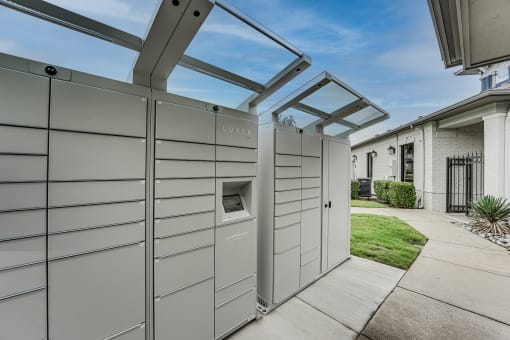 a pergola with a dog kennel attached to the side of a house at Highland Luxury Living Apartments, Lewisville