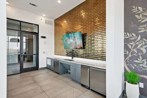 A modern kitchen with a wooden backsplash and stainless steel appliances.