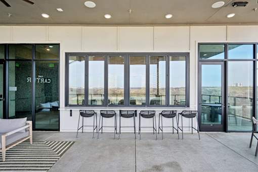 A patio with a table and chairs is shown.