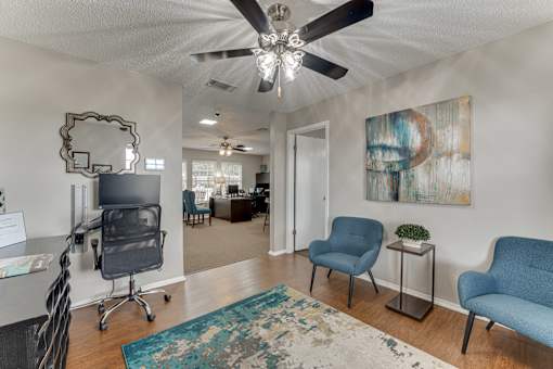 Office space with modern furniture and colorful artwork at Arbors Of Corsicana Apartments, Texas, 75110