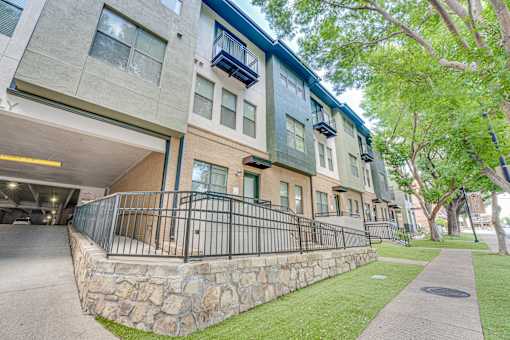 Modern apartment exterior with landscaped entrance at The Barton Apartments, Dallas, 75206