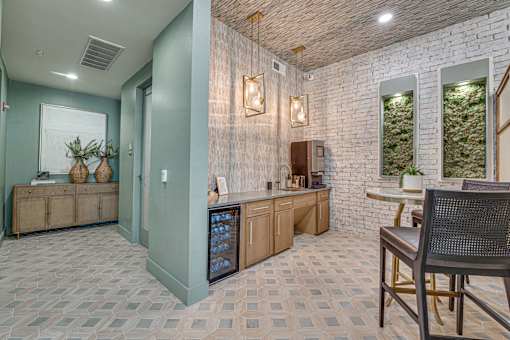 Community coffee bar with seating area at The Barton Apartments, Dallas, Texas