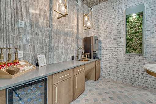 Coffee bar with beverage station and refrigerator at The Barton Apartments, Dallas