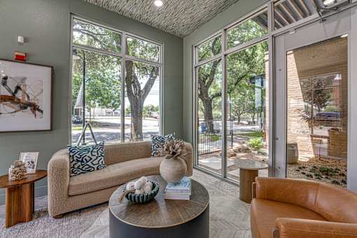 Lobby lounge with modern furniture and large windows at The Barton Apartments, Dallas, TX 75206